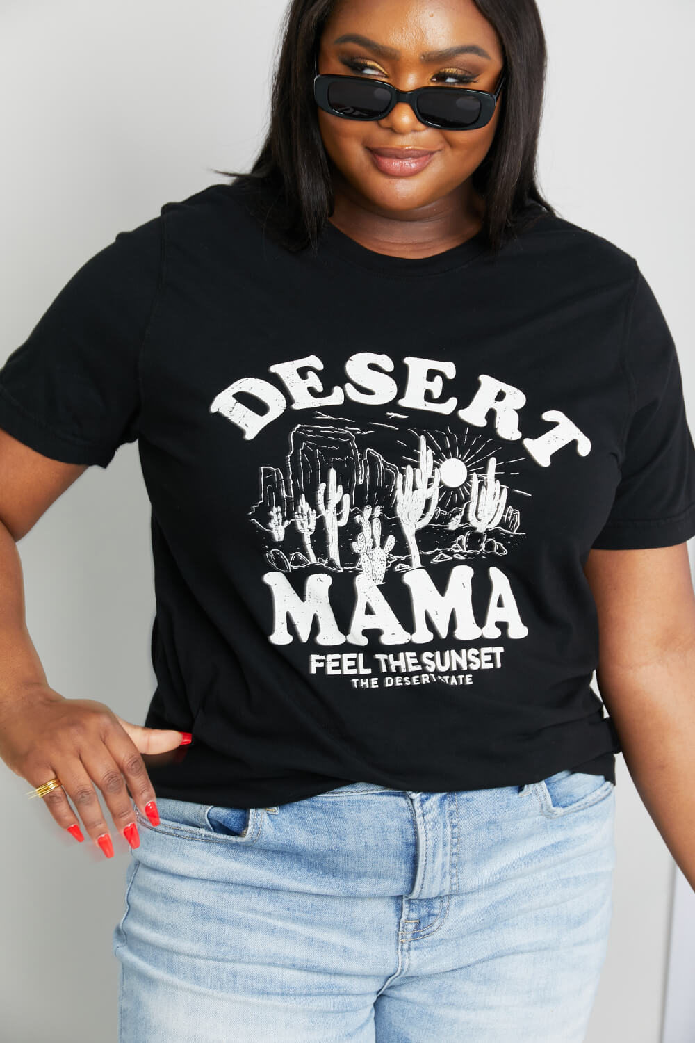 Woman modeling graphic print black tee with graphic tee with white ink - "Desert Mama - Feel the sunset the desert state"