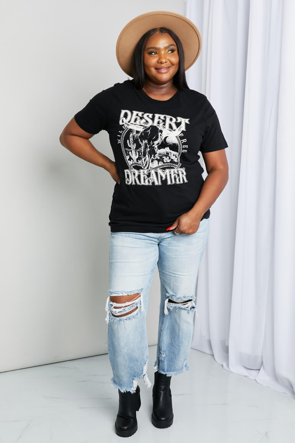 Woman modeling black tee with graphic print with white ink print - "Desert Dreamer" 