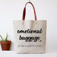 Canvas tote bag with faux leather straps that says "Emotional Baggage jk like it could fit in here"